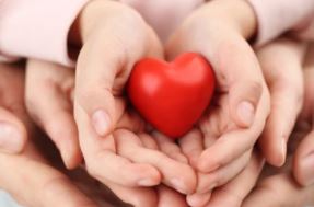 heart in hands of family